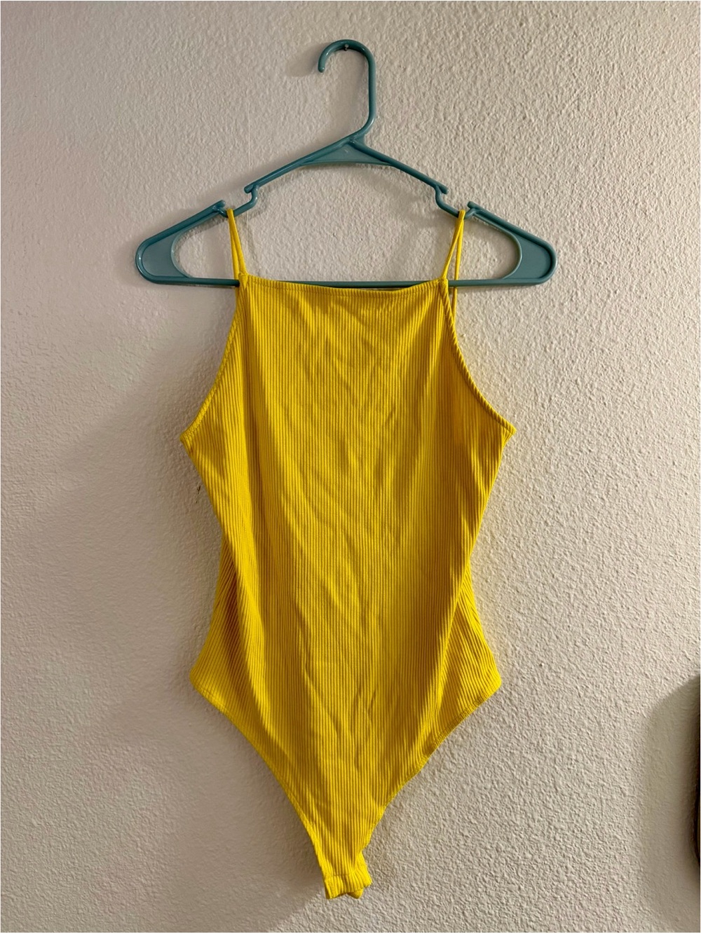 yellow bodysuit